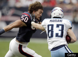 HOUSTON, TX - JANUARY 01: Punt returner Marc Mariani #83 of the Tennessee Titans is tackled by a helmetless Bryan Braman #50 of the Houston Texans at Reliant Stadium on January 1, 2012 in Houston, Texas. (Photo by Bob Levey/Getty Images)