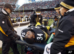 Pittsburgh Steelers running back Rashard Mendenhall is examined on the sideline after an injury in the first half of an NFL football game against the Cleveland Browns, Sunday, Jan. 1, 2012, in Cleveland. (AP Photo/Amy Sancetta)