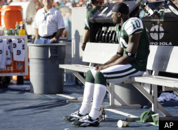 New York Jets wide receiver Santonio Holmes (10) sits alone on the bench in the closing minutes of an NFL football game against the Miami Dolphins, Sunday, Jan. 1, 2012, in Miami. The Dolphins defeated the Jets 19-17. (AP Photo/Lynne Sladky)