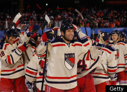 PHILADELPHIA, PA - JANUARY 02: Mike Rupp #71 and the New York Rangers celebrate after defeating the Philadelphia Flyers by a score of 3-2 during the 2012 Bridgestone NHL Winter Classic at Citizens Bank Park on January 2, 2012 in Philadelphia, Pennsylvania. (Photo by Rob Carr/Getty Images)