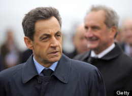 France's President Nicolas Sarkozy (L) arrives with Defence Minister Gerard Longuet (R) at the Lanveoc-Poulmic naval airbase prior to deliver his New Year wishes to French army personnel on January 3, 2012 in Lanveoc, western France. (PHILIPPE WOJAZER/AFP/Getty Images)