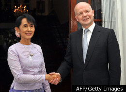 Myanmar democracy icon Aung San Suu Kyi (L) shakes hands with British Foreign Secretary William Hague ahead of a meeting at the British ambassador's residence in Yangon