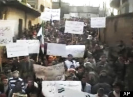 This image made from amateur video and released by Shaam News Network Tuesday, Jan. 3, 2012, purports to show Syrians chanting slogans during a demonstration in Hama, Syria. (AP Photo/Shaam News Network via APTN)