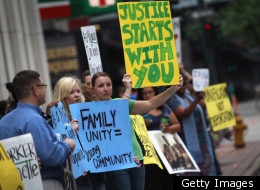 Protesters in Denver hold signs against the deportation of a Mexican immigrant in July of 2011.