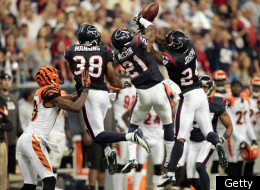 HOUSTON, TX - JANUARY 07: Johnathan Joseph #24 of the Houston Texans intercepts a pass in the second half against the Cincinnati Bengals during their 2012 AFC Wild Card Playoff game at Reliant Stadium on January 7, 2012 in Houston, Texas. (Photo by Bob Levey/Getty Images)