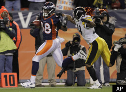 Denver Broncos wide receiver Demaryius Thomas (88) breaks away from Pittsburgh Steelers defensive back Ryan Mundy (29) for the winning touchdown in overtime of an NFL wild card playoff football game Sunday, Jan. 8, 2012, in Denver. The Broncos won 29-23. (AP Photo/Joe Mahoney)