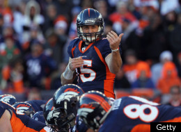 DENVER, CO - JANUARY 08: Quarterback Tim Tebow #15 of the Denver Broncos motions to a receiver during the AFC Wild Card Playoff game at Sports Authority Field against the Pittsburgh Steelers at Mile High on January 8, 2012 in Denver, Colorado. The Broncos defeated the Steelers in overtime 23-29. (Photo by Jeff Gross/Getty Images)