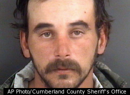 This undated photo provided by the Cumberland County Sheriff's Office shows Ray Lynn Mitcham Jr., of Linden, N.C., arrested Monday, Jan. 9, 2012, in Cumberland County, N.C., for crime against nature with a dog. Debbie Tanna, spokeswoman for the Cumberland County Sheriff's Office, said Mitcham's next door neighbor went to speak with him Jan. 2. The neighbor, who is alsoMitcham's landlord, told detectives she opened the door to his mobile home and saw him attacking her dog. The mixed-breed female