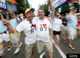 Joe Bednar (R) and Phil Mason look on during the Gay Pride parade on June 26, 2011 in New York City.