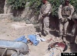 The video depicts what appears to be four Marines urinating on the bloodied corpses of Taliban fighters