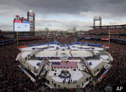 The New York Rangers and the Philadelphia Flyers line up for the national anthem and fly over before the NHL Winter Classic hockey game, Monday, Jan. 2, 2012, in Philadelphia. (AP Photo/Mel Evans)