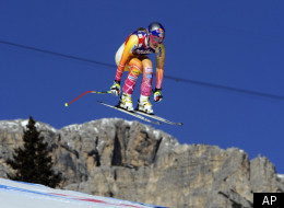 Lindsey Vonn, of the United States, takes a jump during an alpine ski, women's World Cup downhill, in Cortina D'Ampezzo, Italy, Saturday, Jan. 14, 2012. Vonn finished in second place. (AP Photo/Alessandro Trovati)