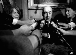 In this Oct. 21, 1971 file photo, Pablo Neruda, poet and then Chilean ambassador to France, talks with reporters in Paris after being awarded the 1971 Nobel Prize for Literature.