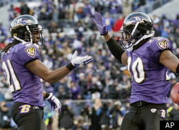 Baltimore Ravens free safety Ed Reed celebrates his interception with cornerback Lardarius Webb, left, during the second half of an NFL divisional playoff football game against the Houston Texans in Baltimore, Sunday, Jan. 15, 2012. The Ravens defeated the Texans 20-13. (AP Photo/Patrick Semansky)