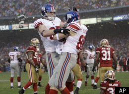 New York Giants tight end Bear Pascoe, right, celebrates with tight end Jake Ballard after scoring on a six-yard touchdown pass against the San Francisco 49ers during the first half of the NFC Championship NFL football game Sunday, Jan. 22, 2012, in San Francisco. (AP Photo/Paul Sakuma)