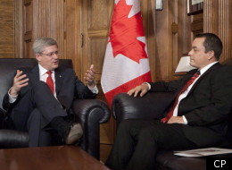Prime Minister Stephen Harper gestures as he sits down to speak with Assembly of First Nations Chief Shawn Atleo in his office on Parliament Hill in Ottawa Thursday December 1, 2011. (CP)