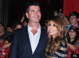 Simon Cowell has revealed he fought for Paula Abdul to keep her seat on 'US X Factor'