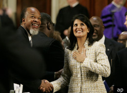 Gov. Nikki Haley, center, and the state of South Carolina filed a lawsuit against the Justice Department for blocking its recently passed voter ID law.