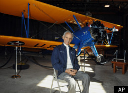 Former Tuskegee Airman Herbert Carter, 94, of Tuskegee, Ala., poses with a PT-17 trainer aircraft in a hangar at Tuskegee Airmen National Historic Site at Moton Field in Tuskegee, Ala., Wednesday, Jan. 18, 2012.