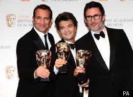 Jean Dujardin, Thomas Langmann and Michel Hazanavicius with their awards for the Artist