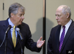Illinois Gov. Pat Quinn, right, and Caterpillar CEO Doug Oberhelman, left, discuss Illinois' business climate and taxes during a news conference Tuesday, April 5, 2011, in Peoria, Ill. (AP Photo/Seth Perlman)