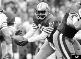 FILE - In this Jan. 6, 1985, file photo, San Francisco 49ers wide receiver Freddie Solomon (88) prepares for a handoff after lining up at quarterback during the NFL football NFC championship game against the Chicago Bears in San Francisco. Solomon, the former Miami Dolphins and 49ers wide receiver who became known as