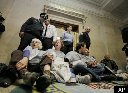 Activists protest mental health facility closures inside Chicago's City Hall last fall.