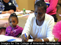 Lanajh Jones, 2, waits patiently as her grandmother Rozeann Gorman, of Minneapolis, registers for a free screening at North Point Health & Wellness Center's See, Test & Treat™, a program that provides free breast and cervical cancer screening and same day diagnosis and care, for patients 40 and older in Minneapolis, Minn. African American women have a 24% higher mortality rate for breast cancer then non-Hispanic white women in Minnesota.