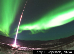 A two-stage Terrier-Black Brant rocket arced through aurora about 200 miles above Earth on the Magnetosphere-Ionosphere Coupling in the Alfvén resonator (MICA) mission to study the physics of the northern lights. Stage one of the rocket has just separated and is seen falling back to Earth in this photo taken on Feb. 18, 2012.