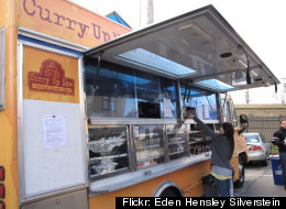 A hungry patron orders from the popular Curry Up Now food truck in San Francisco.