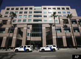 Homeland Security police cars are shown parked outside the Long Beach, Calif., Federal Courthouse Friday, Feb. 17, 2012 in Long Beach, Calif. On Thursday an agent shot another agent who was then shot and killed by a third agent. The wounded agent was hospitalized. This shooting at the federal building of a high-ranking Immigration and Customs Enforcement official was over an unspecified disciplinary matter, a person familiar with the case said. (AP Photo/Nick Ut)