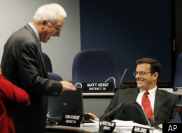 State Rep. John Kavanagh, left, speaks with fellow Republican Rep. Tom Forese prior to budget hearings in the committee in March 2011. Kavanagh was the sponsor of the minimum tuition bill. In the past he sponsored a bill to challenge automatic citizenship guaranteed under the the 14th Amendment. (AP Photo/Ross D. Franklin)