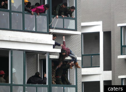 Police spent three hours trying to talk the woman to safety before pulling her off the ledge
