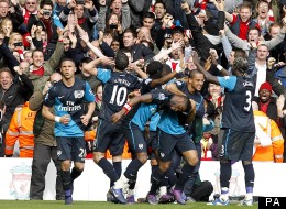Robin van Persie celebrates his Anfield winner along with Arsenal supporters and team-mates