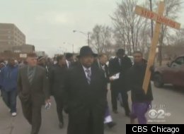 Pfleger and dozens of parishioners march through Auburn Gresham.