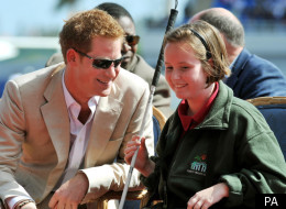 Prince Harry talks to blind girl Anna Albury 12, in the National Athletics Stadium in Nassau