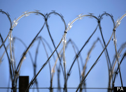 One in eight prisoners developed a drug problem after being locked up in jail, inspectors said on Tuesday.
