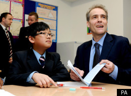 Expert Adviser on Behaviour Charlie Taylor studies a pupils work