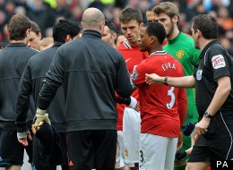 Luis Suarez refuses to shake Patrice Evra's hand, but Johnson suggests otherwise