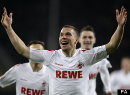 Lukas Podolski celebrates scoring for Cologne