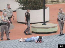 The 23-year-old lay bleeding on the ground