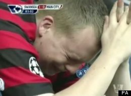 A Manchester City fan weeps after Swansea take the lead at the Liberty Stadium