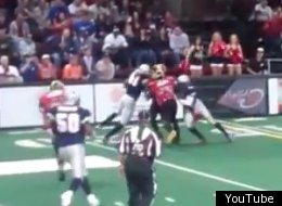 Terrell Owens gets tackled over a wall.