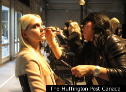 A model gets ready for Rudsak during Toronto Fashion Week 2012.