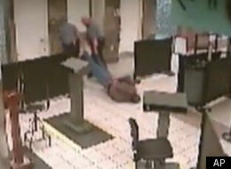 Security footage appears to show two Oklahoma City police officers dragging a handcuffed man face down through an airport.