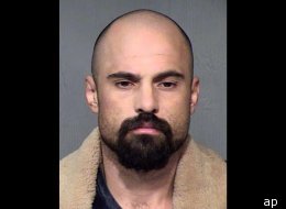 Michael Crane, accused of murdering three people, acted strangely during a court appearance.