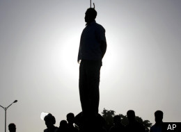 The silhouette of convicted man Mahdi Faraji is seen while he is being hanged in the city of Qazvin, about 80 miles (130 kilometers) west of the capital Tehran, Iran, Thursday, May, 26, 2011. (AP)