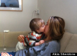 Alicia Silverstone feeding her son
