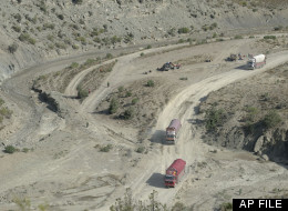 Trucks drive in the mountains of Paktika province (AP Photo/Axel Heimken)