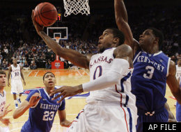 Kansas' Thomas Robinson (0) drives past Kentucky's Terrence Jones (3) during the second half of an NCAA college basketball game, Tuesday, Nov. 15, 2011, at Madison Square Garden in New York.